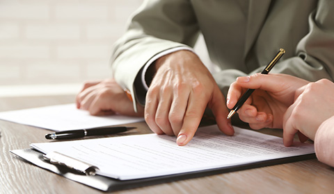 person looking though a financial form