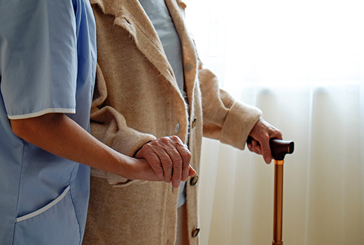 Elderly person being cared for in care home