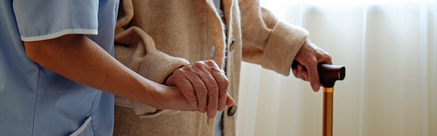 Elderly person being cared for in care home